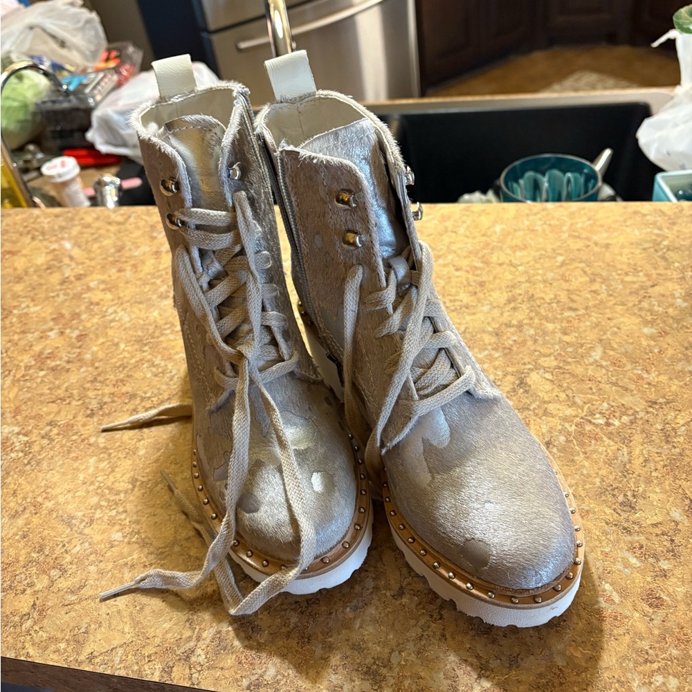 Metallic boots; lug soles1 1/2 inch heels. I wore 1 time